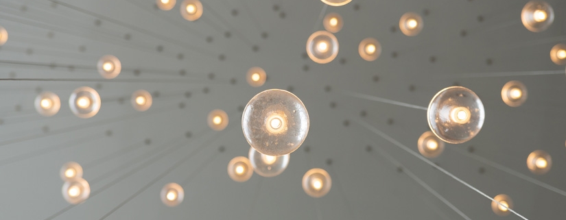 Strands of multiple modern light bulbs signifying diversifying innovation activities