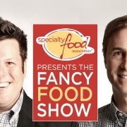 Photo of Jeff Johns and Sean Smyth in front of the Fancy Food Show logo