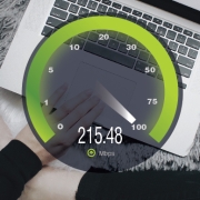 Image of a speed dial overlaying a laptop