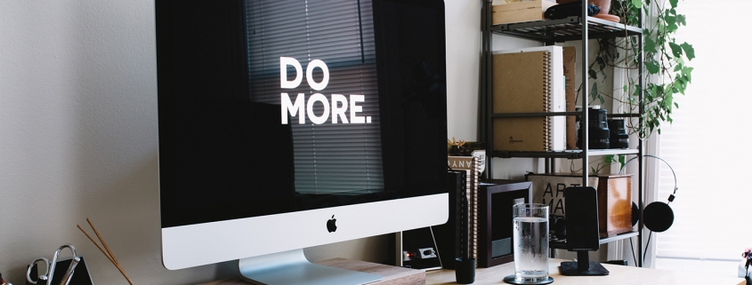 Picture of a computer monitor with the message "DO MORE" displayed on it.