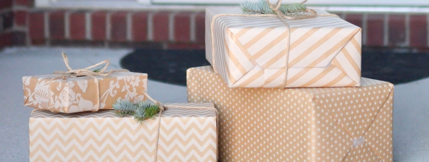 Stack of wrapped presents on a front porch