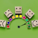 image of a colorful dial and emoji-faced blocks to represent dialing up empathy